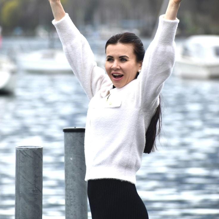 Alex Rivera, Lead Design Curator at IsletMapleRune, reviewing corporate floral arrangements